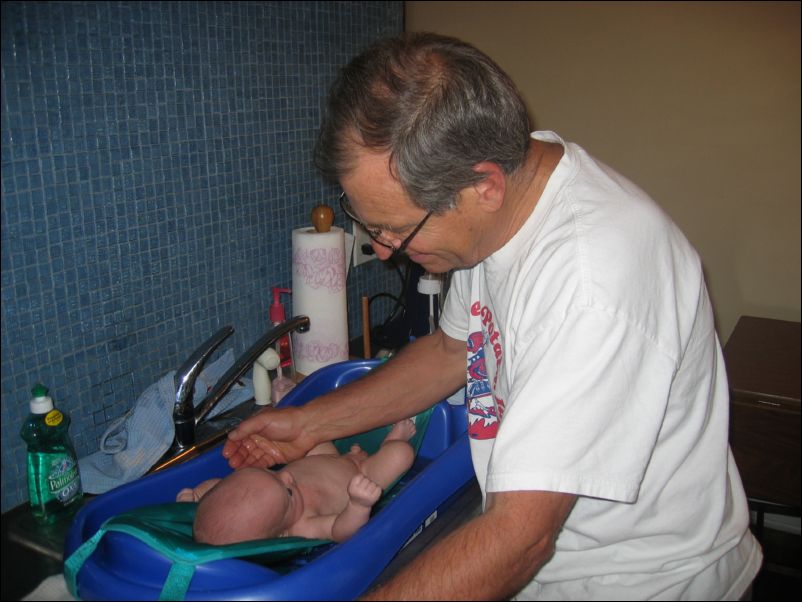 Pops giving Owen a bath